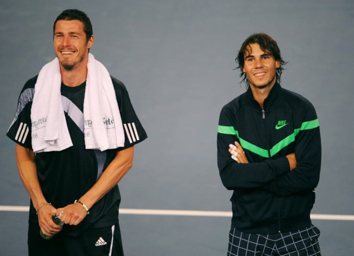 Marat Safin of Russia (L) stands beside