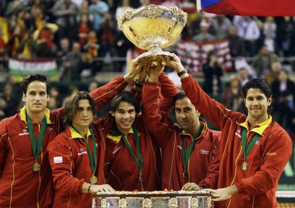 Spain's Davis Cup team members raise up the Davis Cup trophy at the Palau Sant Jordi indoor arena in Barcelona,